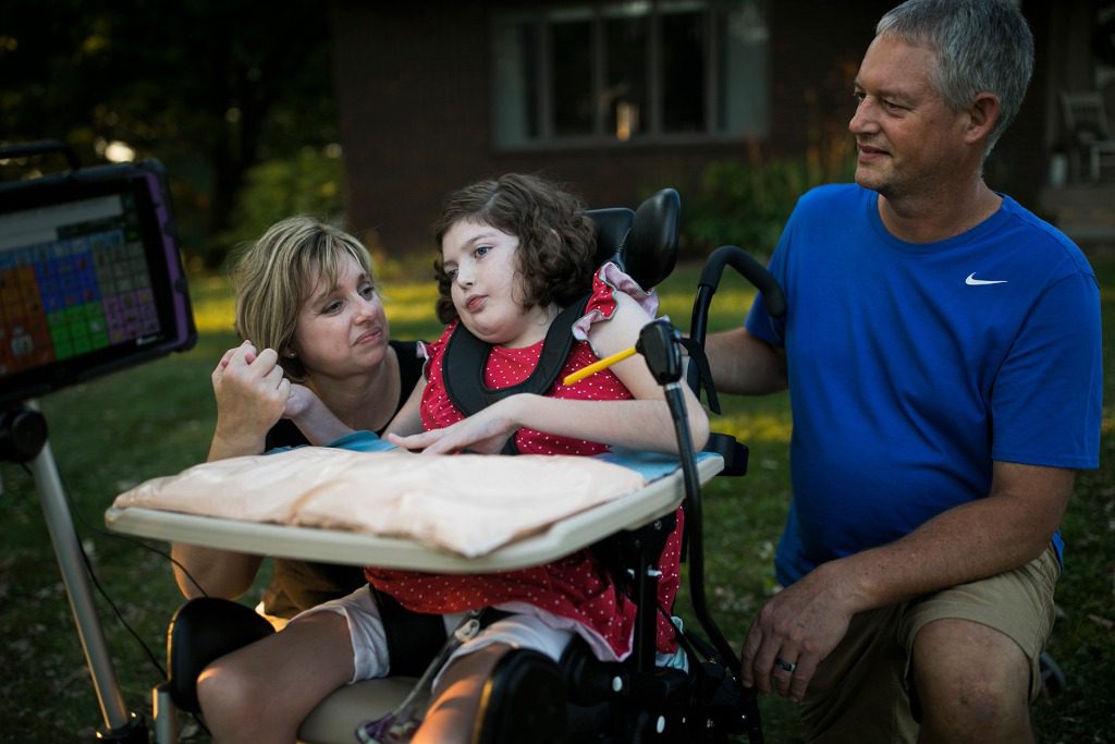 Bella Yoder with her parents outside of their home in Sugar Creek, OH on September 8, 2020.