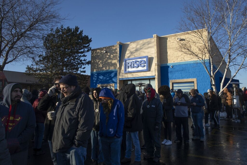 People wait in line to enter the Green Thumb Industries Rise Mundelein dispensary in Mundelein, Illinois, U.S., on Wednesday, Jan. 1, 2020. Illinois' legalization of recreational pot is likely to be the industry's "most significant fundamental catalyst" in 2020 and Cresco Labs Inc. and Green Thumb Industries Inc. will benefit the most, according to investment firm Compass Point. Photographer: Daniel Acker/Bloomberg via Getty Images