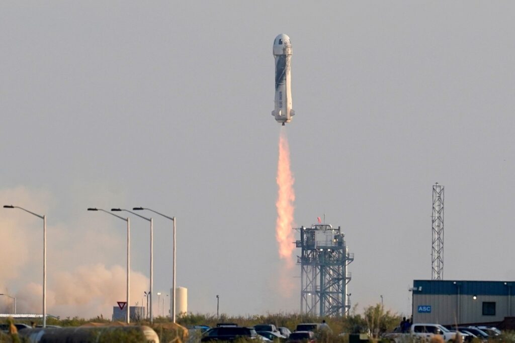 Blue Origin's New Shepard rocket launches carrying passengers Jeff Bezos, founder of Amazon and space tourism company Blue Origin, brother Mark Bezos, Oliver Daemen and Wally Funk, from its spaceport near Van Horn, Texas, Tuesday, July 20, 2021. (AP Photo/Tony Gutierrez)