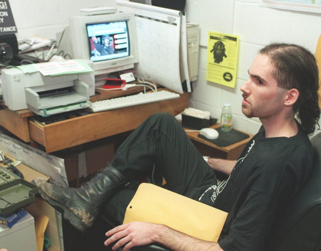 Davis Wolfgang Hawke sits in his dorm, in this undated photo, on the Wofford campus in Spartanburg, S.C. AOL is preparing to dig for buried gold and platinum on property in Massachusetts owned by the parents of Hawke, a man it sued for sending millions of unwanted spam e-mails to its customers. AOL won a $12.8 million judgment last year in U.S. District Court in Virginia against Hawke but has been unable to contact Hawke to collect any of the money he was ordered to pay. (AP Photo/Spartanburg Herald-Journal, Gerry Pate)