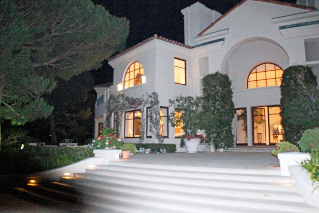 This Oct. 17, 2011 photo provided by U.S. Immigration and Customs Enforcement (ICE) shows the exterior of the Malibu, Calif., mansion of the son of Equitorial Guinea's president, Teodoro Nguema Obiang Mangue, during the execution of a search warrant. Mangue must sell the $30 million Malibu mansion, a Ferrari and Michael Jackson memorabilia and then give the proceeds to the citizens of his impoverished country, under a settlement announced Friday, Oct. 10, 2014 by U.S. authorities who said he bought the lavish items with money stolen from the African nation. Mangue, who is also Equatorial Guinea's second vice president, agreed to turn over $20 million from the sale of these assets to a charitable organization to be used to benefit the people of his country, the U.S. Department of Justice said. Another $10.3 million will be forfeited to the U.S. government. (AP Photo/U.S. Immigration and Customs Enforcement)