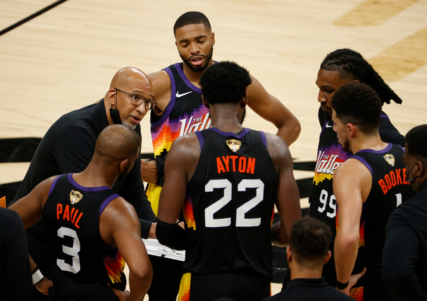 PHOENIX, ARIZONA - JULY 17: Head coach Monty Williams of the Phoenix Suns huddles his team during a time out against the Milwaukee Bucks during the second half in Game Five of the NBA Finals at Footprint Center on July 17, 2021 in Phoenix, Arizona. NOTE TO USER: User expressly acknowledges and agrees that, by downloading and or using this photograph, User is consenting to the terms and conditions of the Getty Images License Agreement. (Photo by Christian Petersen/Getty Images)