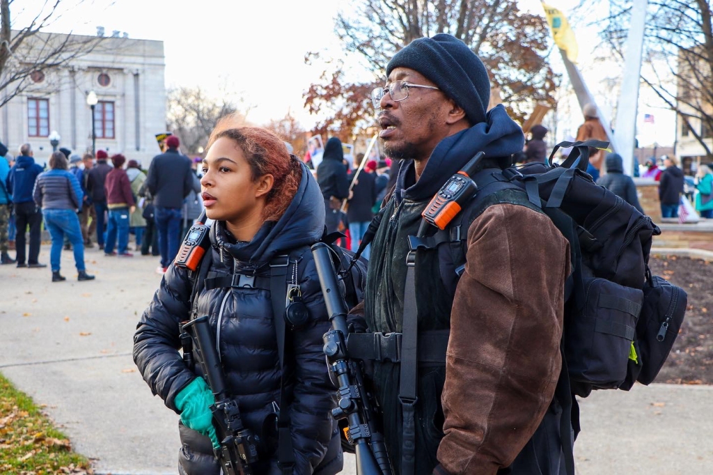 Jade Jordan and her father, Erik Jordan, provide security for protesters marching in Kenosha, Wis. on Nov. 21, 2021. (Madison Muller/Rolling Stone)