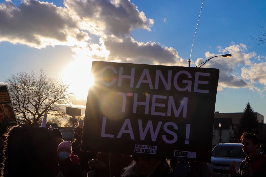 One of the signs held by protesters during a march in Kenosha, Wis. on Nov. 21, 2021. (Madison Muller/Rolling Stone)