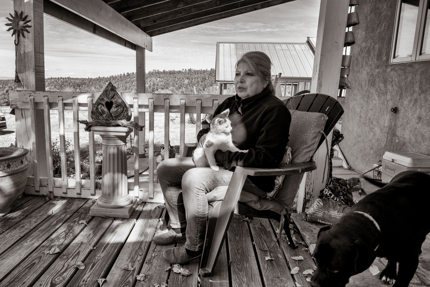 Dolores Guzmán on the porch of her home in Truchas, eight miles from Chimayó. Guzmán was the principal of Chimayó Elementary at the time of the bust, which affected kids at the school and families throughout the community.