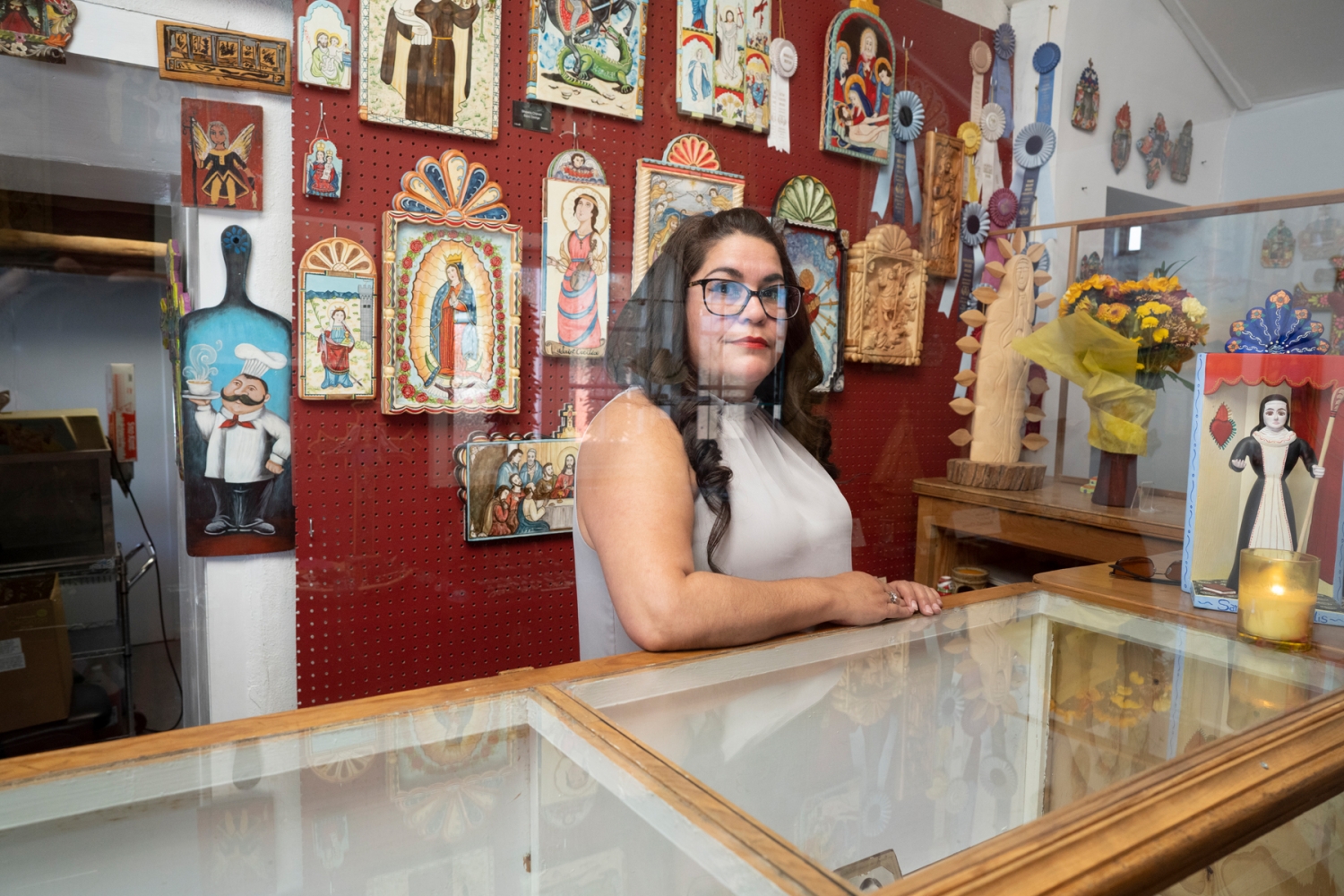 Shawna Lee Chavez in her gift shop and gallery in Chimayó. Chavez, an accomplished santera (creator of religious-themed art) grew up in a family plagued by addiction and now dedicates much of her time to combating it among youths in the community.