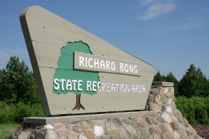 Richard Bong State Recreation Area entrance sign. (Photo by: Jeffrey Greenberg/Universal Images Group via Getty Images)